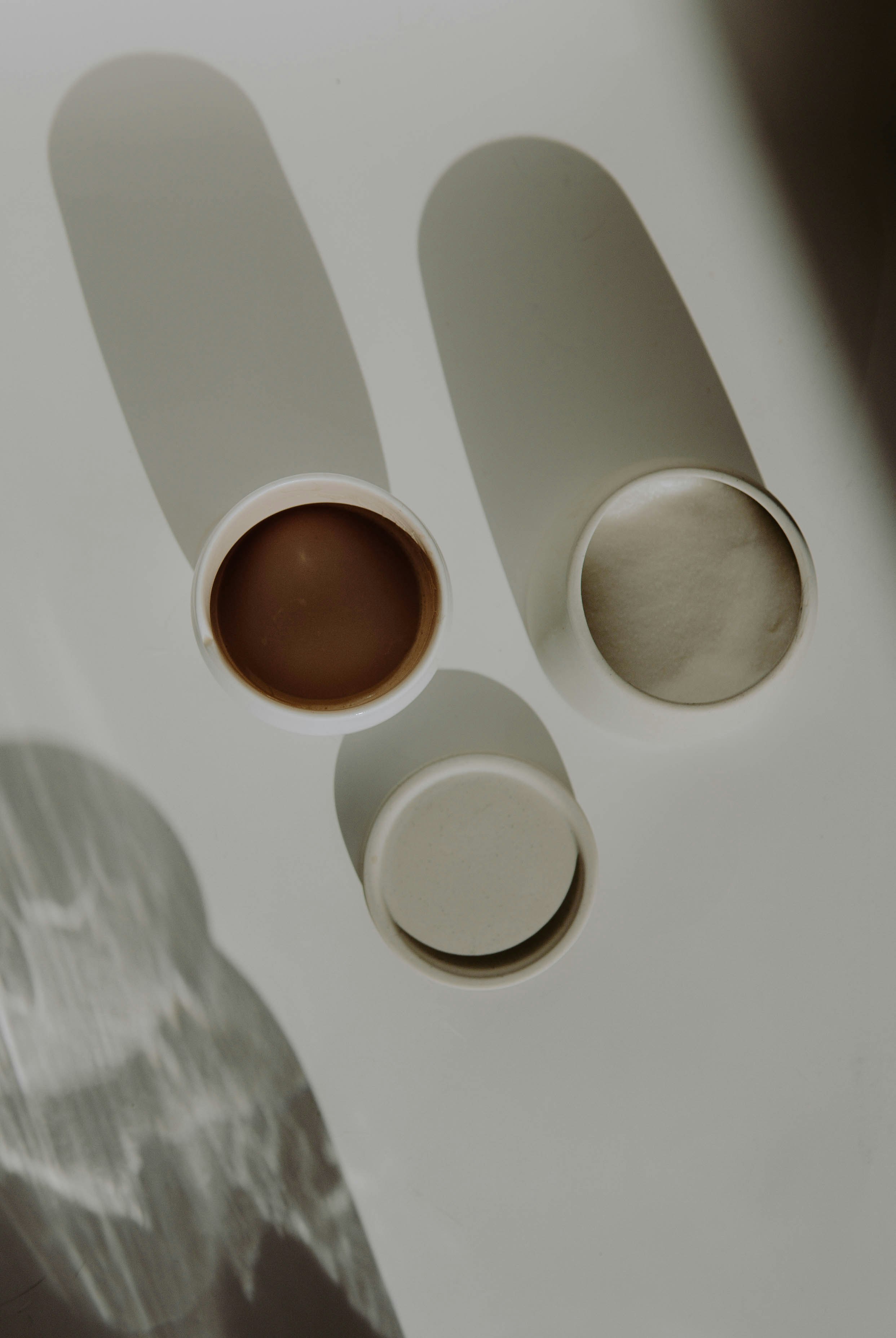 2 white round ceramic bowls on white table